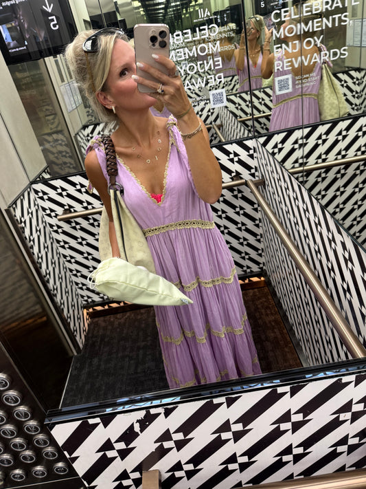 Woman purple dress beach shopping